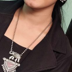 Traditional oxidised elephant necklace set with Monalisa stone and pearl beads in antique silver finish.