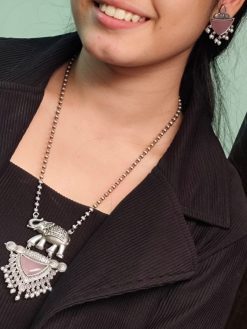 Traditional oxidised elephant necklace set with Monalisa stone and pearl beads in antique silver finish.