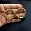 Gold plated geometric stud earrings for modern fashion lovers.