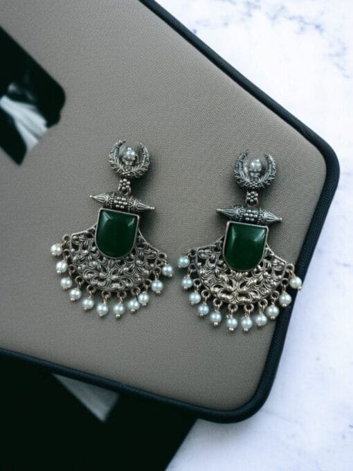 Oxidized half moon earrings with floral design, pearl, and Monalisa stone.