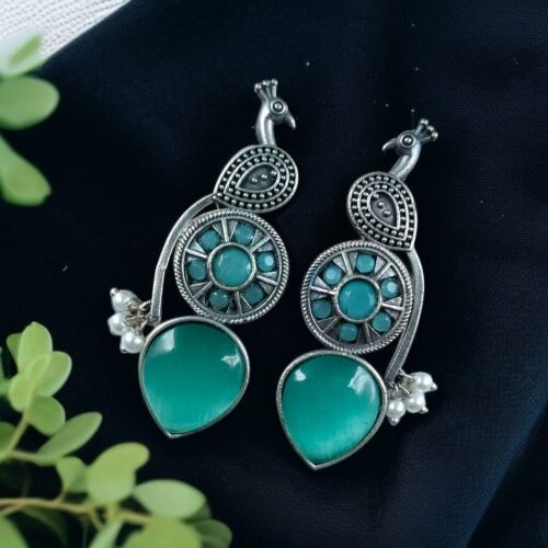 Oxidized silver peacock earrings with Monalisa stone and pearl drops.