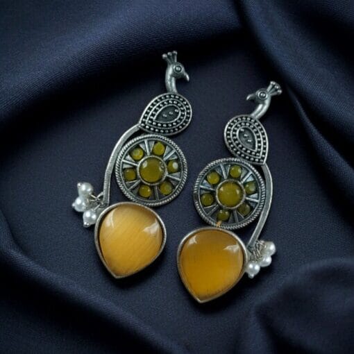 Oxidized silver peacock earrings with Monalisa stone and pearl drops.