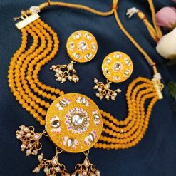 Gold plated Kundan Meena necklace set with stones and pearls.