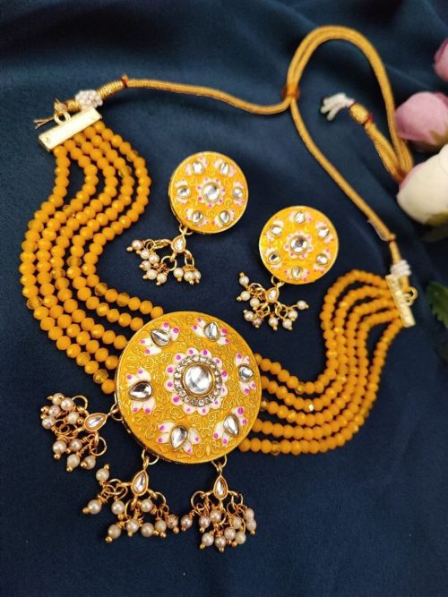 Gold plated Kundan Meena necklace set with stones and pearls.