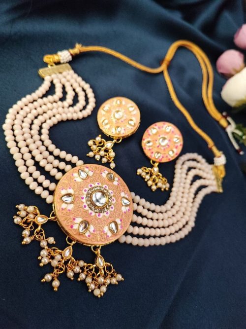 Gold plated Kundan Meena necklace set with stones and pearls.