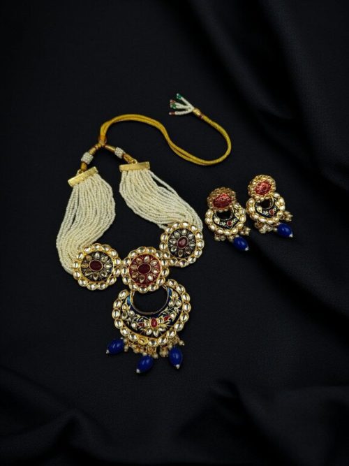 Handmade Meenakaari bridal necklace set with pearls and stones.