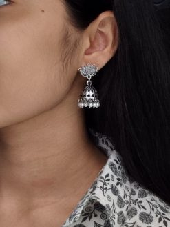 Handcrafted oxidized lotus earrings with pearl detailing for daily ethnic wear.