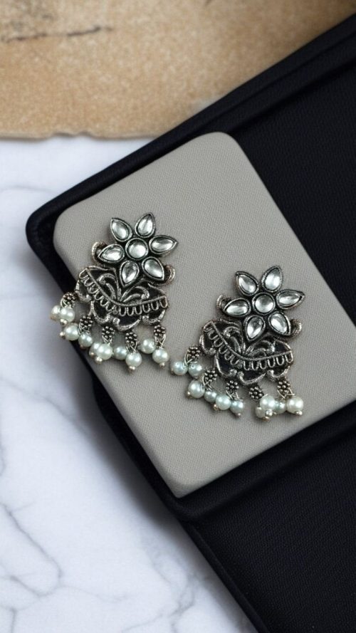 Silver-plated flower earrings with pearl detail for daily traditional wear.