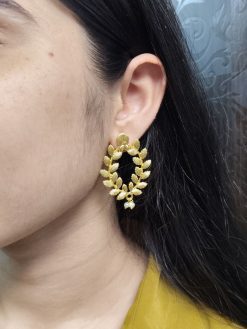 Golden leaf earrings with pearl accents for daily ethnic wear.