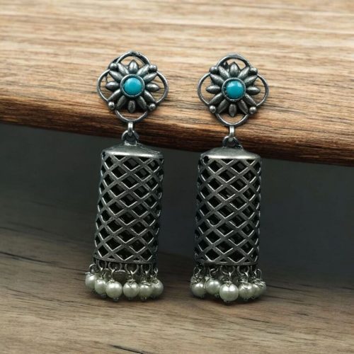 Antique oxidized silver filigree jhumka earrings for traditional wear.