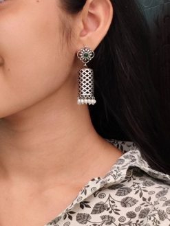 Antique oxidized silver filigree jhumka earrings for traditional wear.