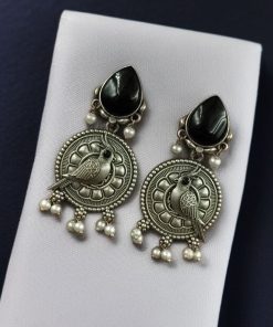 Antique silver parrot dangler earrings with Monalisa stone and pearl accents.