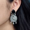 Antique silver parrot dangler earrings with Monalisa stone and pearl accents.