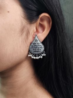 Handcrafted oxidized mantra earrings with pearl accents for traditional wear.