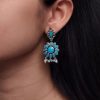 oxidized silver plated flower dangler earrings with stone and pearl detailing