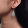 Handcrafted floral hook earrings in oxidized German silver