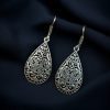 Handcrafted floral hook earrings in oxidized German silver