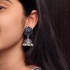 Oxidised silver plated jhumka earrings with stone and pearl detailing