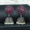 Oxidised silver plated jhumka earrings with stone and pearl detailing