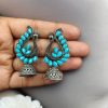 Antique oxidised peacock jhumki earrings in German silver with stone work