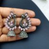 Antique oxidised peacock jhumki earrings in German silver with stone work