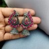Antique oxidised peacock jhumki earrings in German silver with stone work