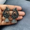 Antique oxidised peacock jhumki earrings in German silver with stone work