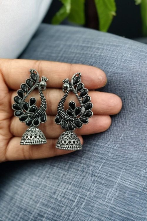 Antique oxidised peacock jhumki earrings in German silver with stone work