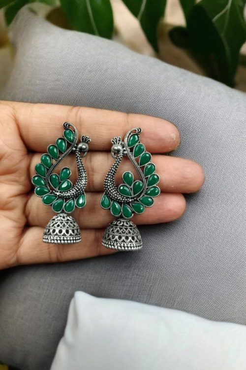 Antique oxidised peacock jhumki earrings in German silver with stone work