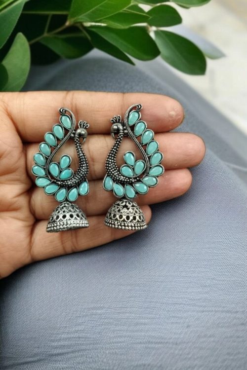Antique oxidised peacock jhumki earrings in German silver with stone work
