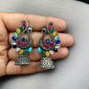 Antique oxidised peacock jhumki earrings in German silver with stone work