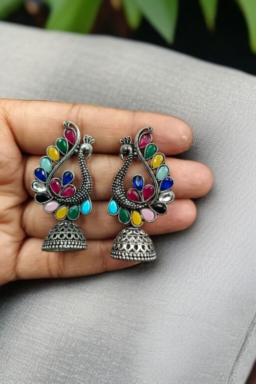 Antique oxidised peacock jhumki earrings in German silver with stone work