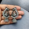 Antique oxidised peacock jhumki earrings in German silver with stone work