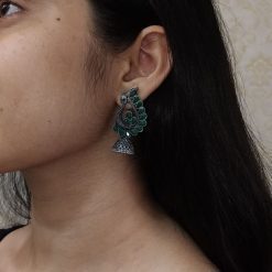 Antique oxidised peacock jhumki earrings in German silver with stone work