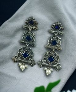 Floral 3-layer dangler earrings with pearls and stone accents.