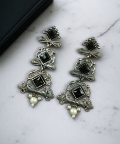 Floral 3-layer dangler earrings with pearls and stone accents.