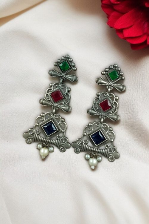 Floral 3 layer earrings with pearls and stone accents.
