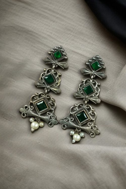 Floral 3-layer dangler earrings with pearls and stone accents.