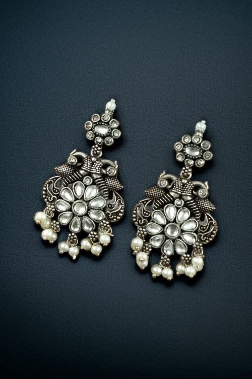 Silver plated peacock dangler earrings with stone and pearl detailing