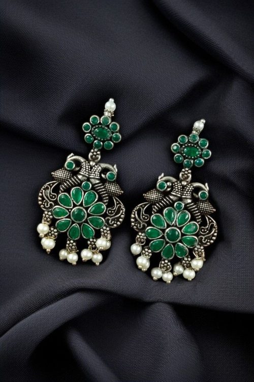 Silver plated peacock dangler earrings with stone and pearl detailing