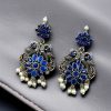 Silver plated peacock dangler earrings with stone and pearl detailing
