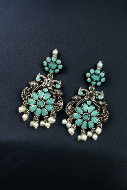 Silver plated peacock dangler earrings with stone and pearl detailing