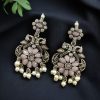 Silver plated peacock dangler earrings with stone and pearl detailing