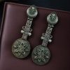 Lightweight oxidised silver plated flower dangler earrings with pearl and stone work.