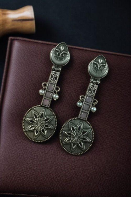 Lightweight oxidised silver plated flower dangler earrings with pearl and stone work.