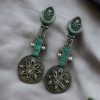 Lightweight oxidised silver plated flower dangler earrings with pearl and stone work.