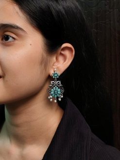 Silver plated peacock dangler earrings with stone and pearl detailing