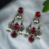 Monalisa stone dangler earrings with pearl in silver plated finish
