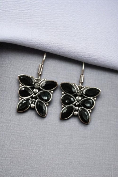 Oxidized butterfly hook earrings with stone work in silver plated finish.