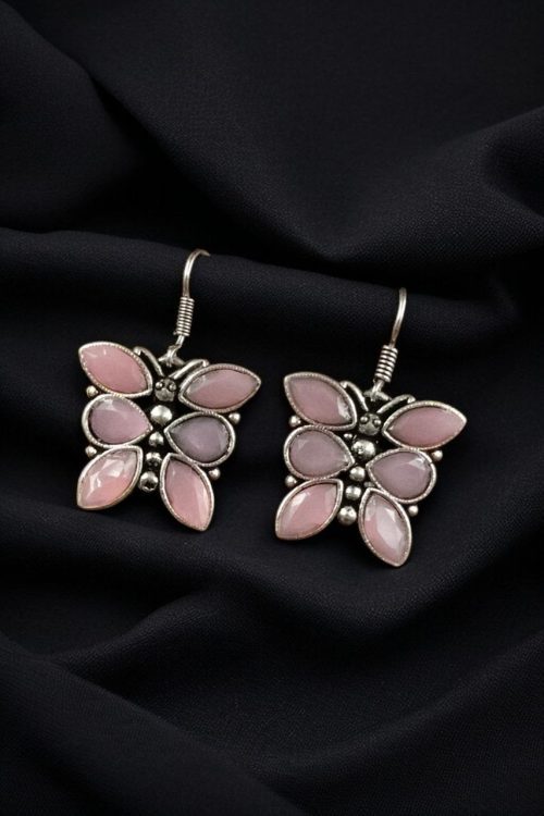Oxidized butterfly hook earrings with stone work in silver plated finish.